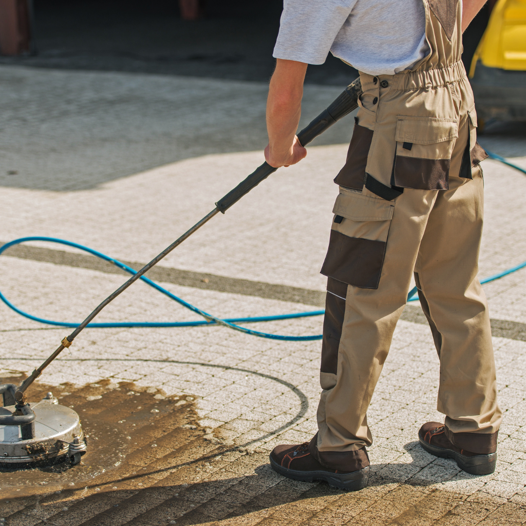 Pressure washing a dirty driveway